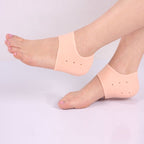 A pair of transparent silicone heel protectors for cracked heels.