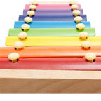 Eco-friendly wooden xylophone for kids, designed for early learning and musical play.