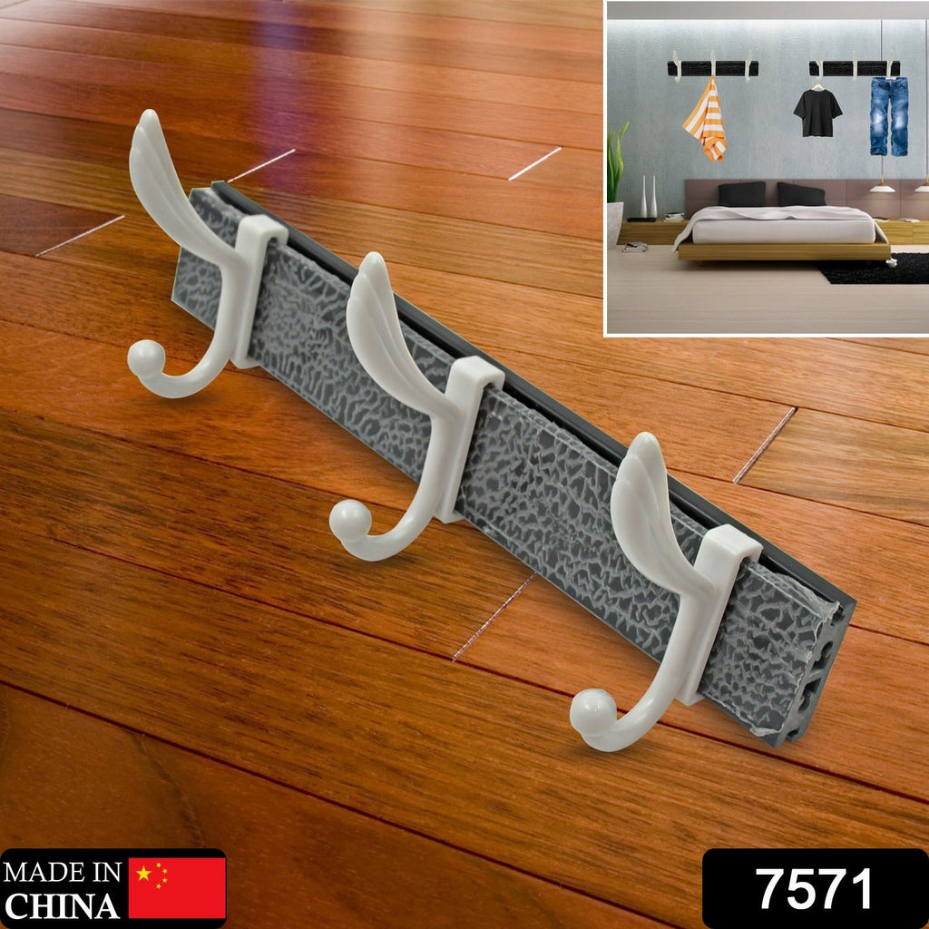 Close-up of durable metal hooks on a solid wood wall mounted coat rack