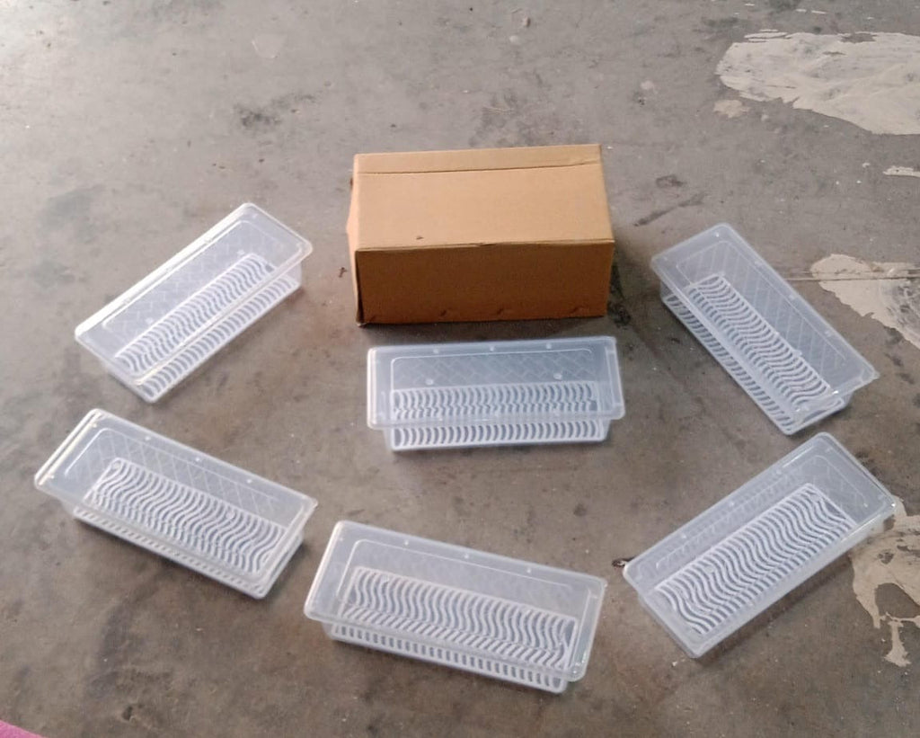 A collection of Organivo freezer storage containers neatly arranged in a kitchen setting.