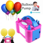 The electric balloon pump shown with a few inflated balloons for scale.