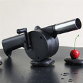 Portable hand crank BBQ air blower fan in black and silver.