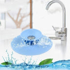 Multicolor silicone sink drainer cover securely fitting a sink drain