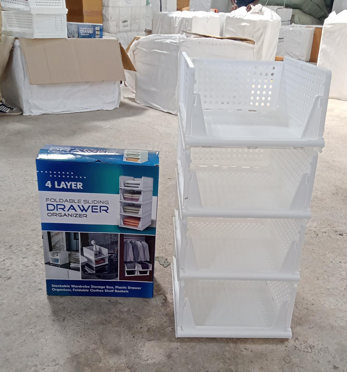 Lifestyle image showing the 4-layer plastic wardrobe drawer organizer in a home setting.