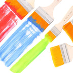 A flat paint brush being used to create a vibrant watercolor painting, demonstrating its smooth application.