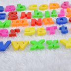 A variety of magnetic letters scattered, showing their vibrant hues.