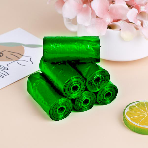 Roll of green compostable garbage bags (17x19) for sustainable waste disposal.