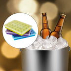 Several stackable multicolor silicone ice cube trays in a freezer.