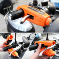Heavy-duty bike brake lock securely attached to a motorcycle handlebar.