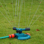 Adjustable 3-arm rotating sprinkler demonstrating various water flow patterns.