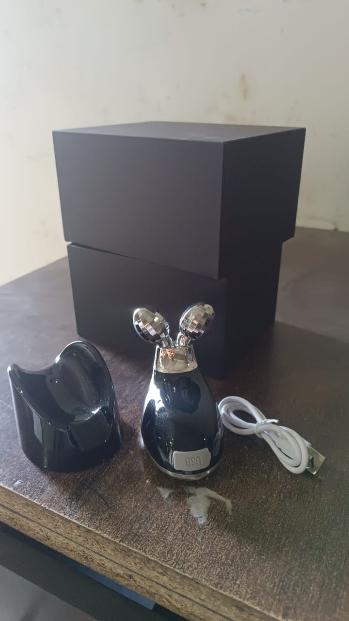 Microcurrent Face Massager stored neatly in its compact holder.