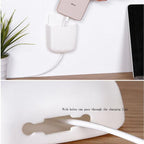 The Wall Mounted Storage Box in multicolour, shown holding a mobile phone and remote control.