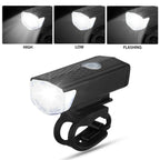 LED bike headlight with USB charging cable attached.