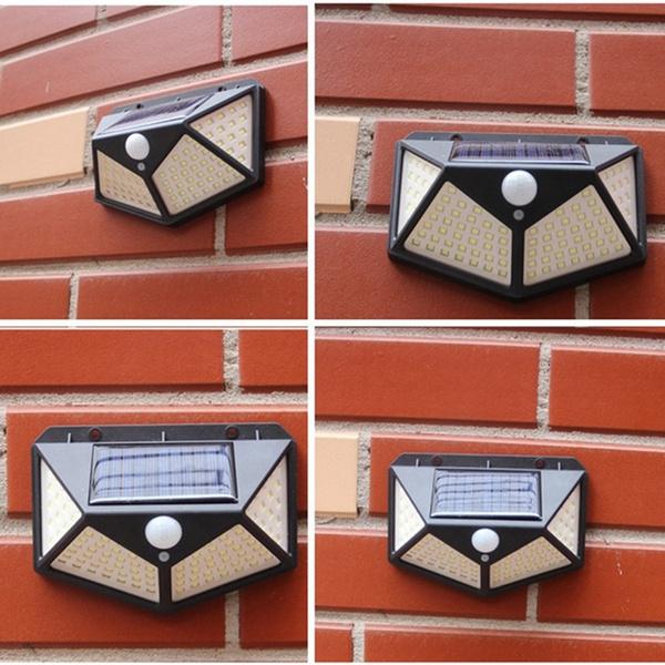 Three Solar Garden Lights installed along an Indian home's outdoor wall.