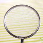 Frying filter spoon with clip, highlighting its oil straining capability.