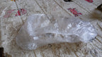 A VelvaBloom disposable shower cap fitted on a mannequin head, showing its universal fit.