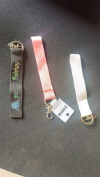 Girl Power fabric ribbon keychain hanging against white background showing mixed colors