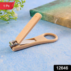 Close view of ergonomic ring-handle nail clipper showing anti-slip textured lever
