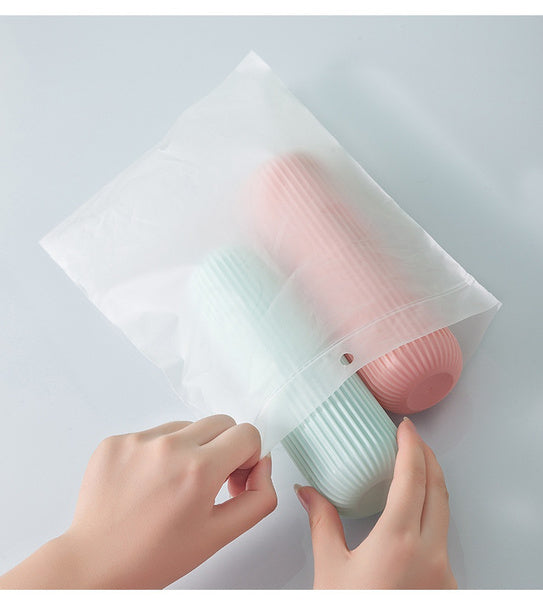 Konvex portable toothbrush holder displayed with its secure cap for travel.