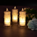 Three Melted Design Flameless Candles glowing softly on a decorative surface, enhancing home ambiance.