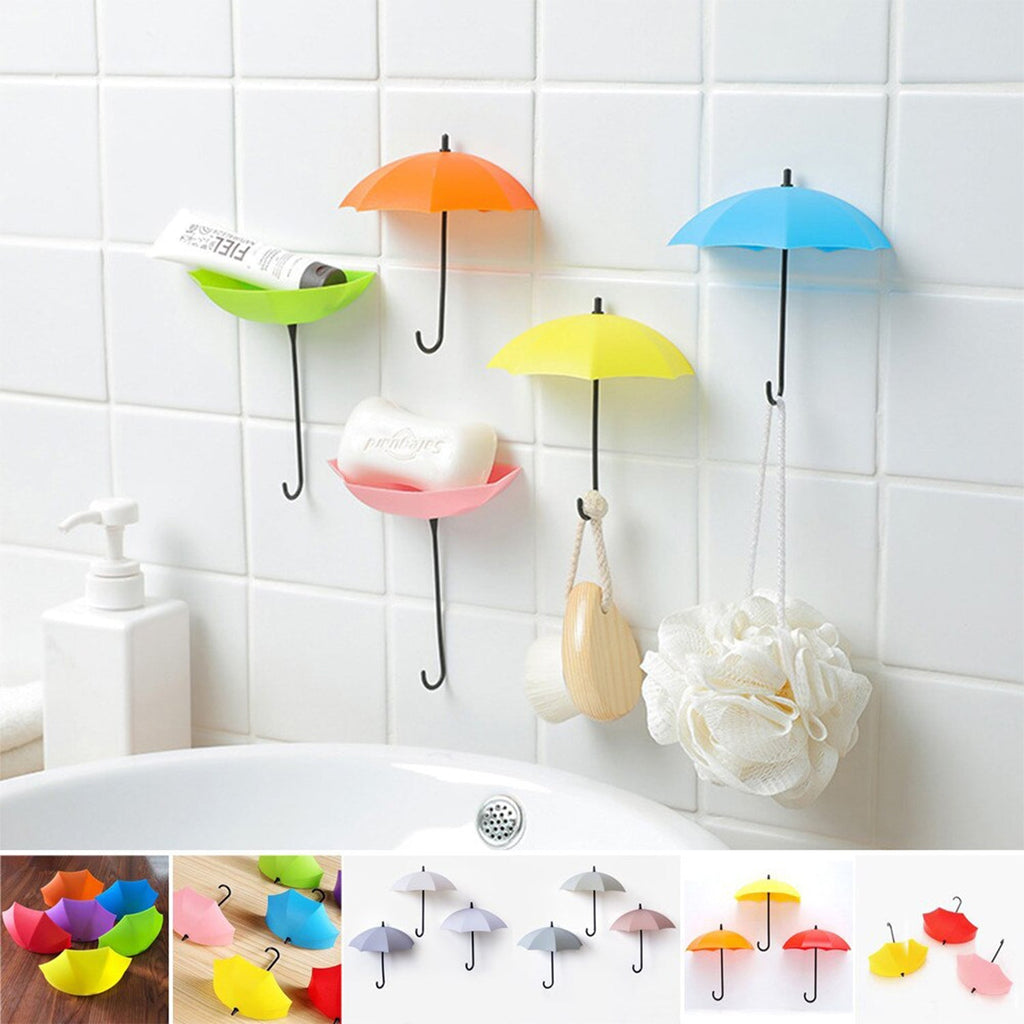 Stylish wall-mounted umbrella hook effectively organizing office supplies on a desk.
