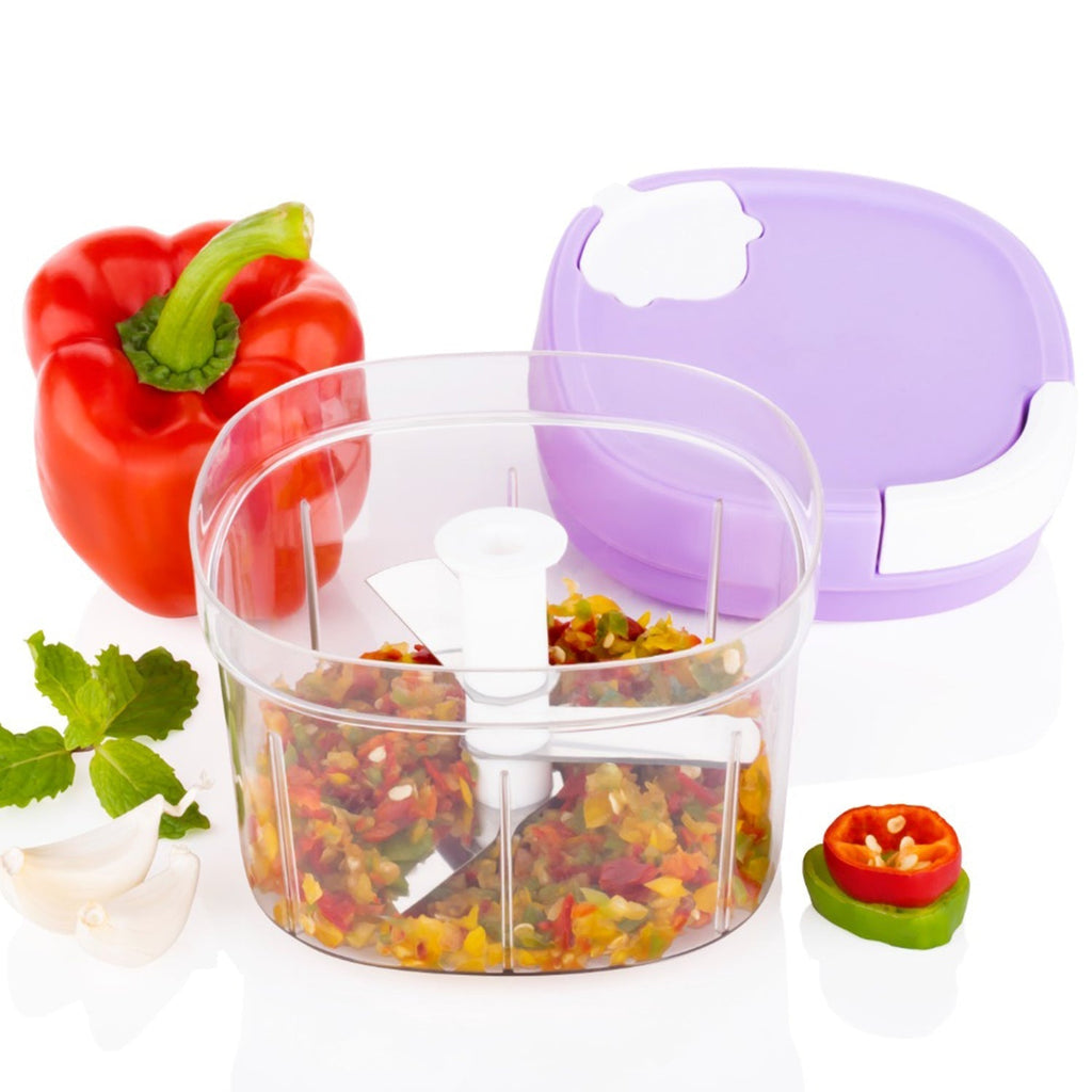 Freshly chopped fruits and vegetables displayed next to the versatile Handy Chopper.
