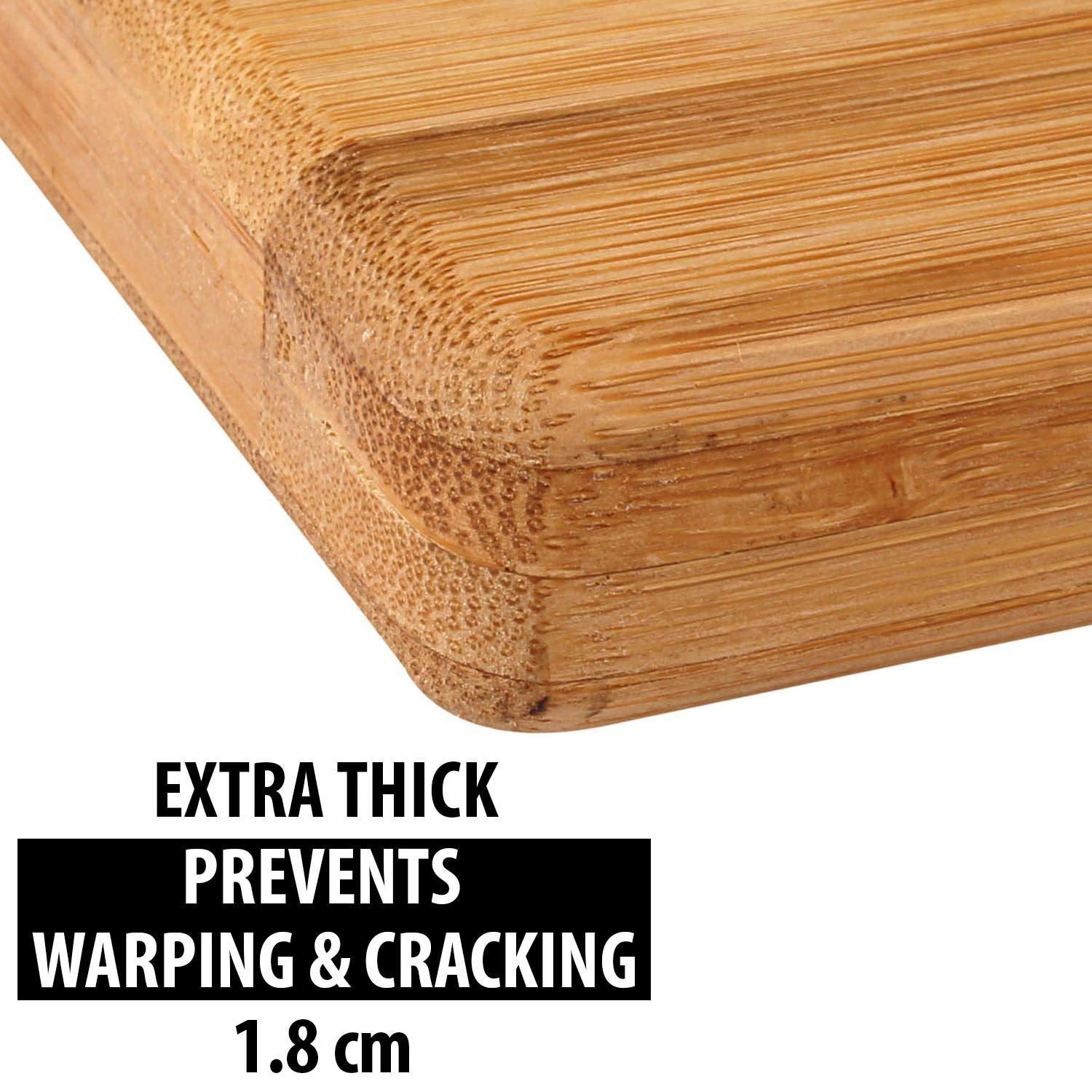 Fresh vegetables being prepared on the spacious wooden cutting board.