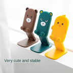 Compact and portable cartoon mobile stand, ideal for travel and desk use.