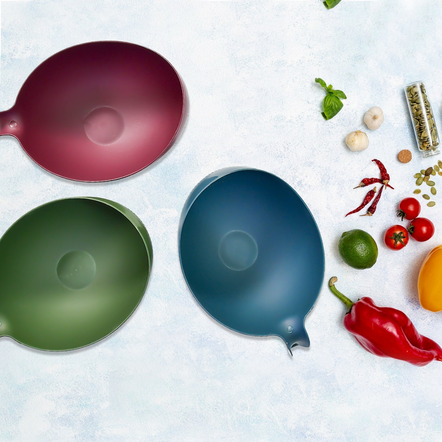 Set of 3 durable plastic rice strainer bowls with handles, perfect for washing food.