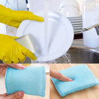 Hand holding a scratch proof kitchen scrubber, demonstrating its flexible design.