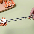 A pair of 31cm multi-functional metal BBQ tongs, ready for grilling.