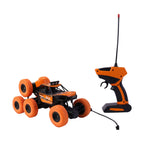 Kids' RC Off-Road Car navigating a challenging rock climbing obstacle with ease.