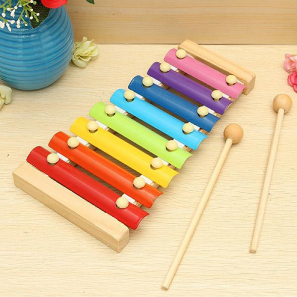 Detail shot of the wooden base and varied colored keys of the Xylophone toy for toddlers.