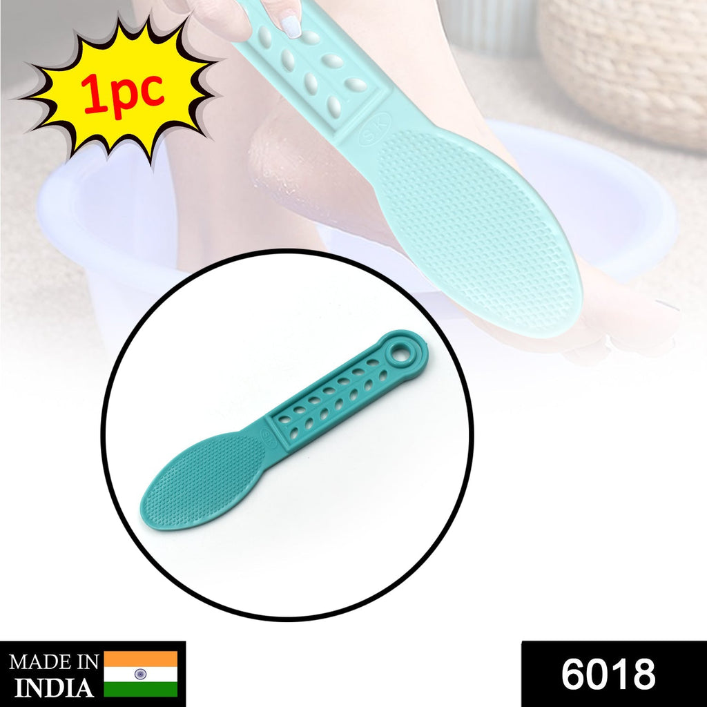 Close-up of the plastic foot scrubber, highlighting its dead skin remover surface.