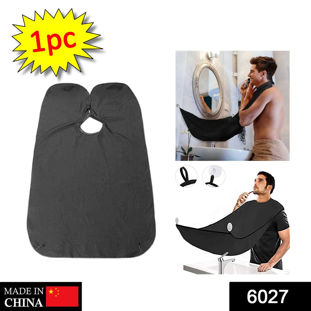 Beard grooming bib securely attached to a mirror with strong suction cups.