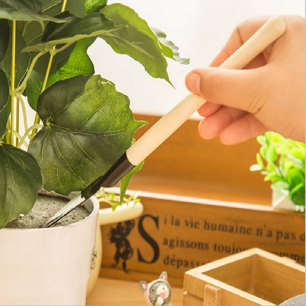 Three pieces of the Kids Garden Tools Set, ready for an exciting day of outdoor gardening.