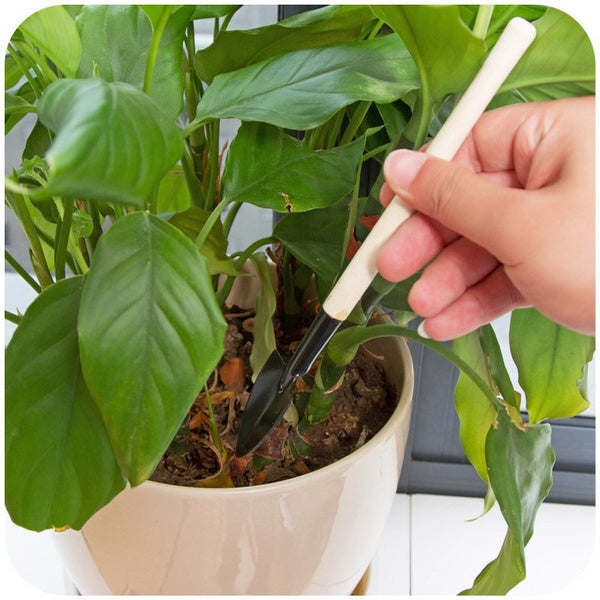 The sturdy carbon steel head of the cultivator from the Kids Garden Tools Set.