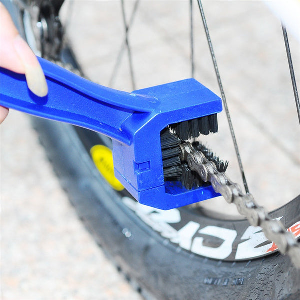 Ergonomic handheld chain cleaning tool designed for easy motorbike chain maintenance.