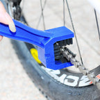 Ergonomic handheld chain cleaning tool designed for easy motorbike chain maintenance.