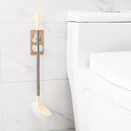 The self-adhesive mop holder demonstrating easy installation on a smooth surface.