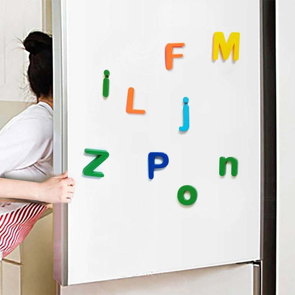 Brightly coloured magnetic letters displayed on a whiteboard, ready for learning.