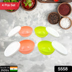 Four small plastic bowls with clear lids, neatly stacked in a kitchen.