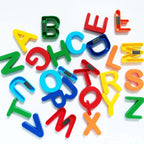 Kids using magnetic letters to form words and learn spelling skills.