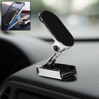 A 360° rotating magnetic car phone holder made of metal, shown on a car dashboard.