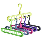 An organised wardrobe section with multiple anti-slip 9-hole space-saving hangers.
