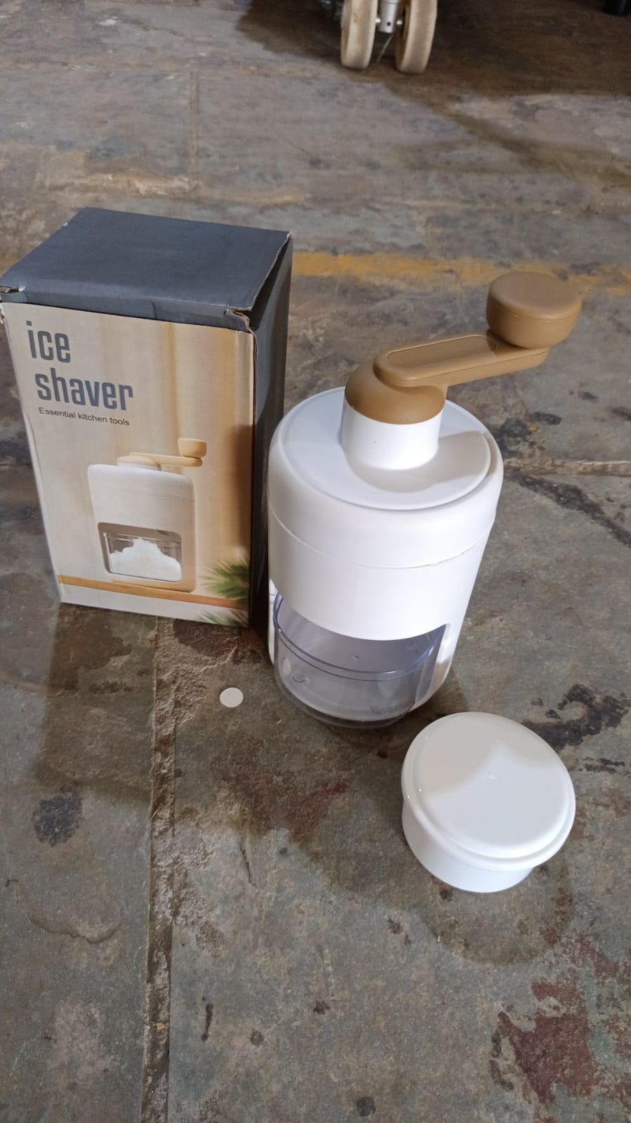 Small ice crusher featuring durable stainless steel blades for homemade shaved ice.