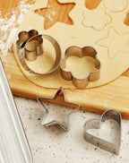 The complete 12-piece stainless steel cookie cutter set displayed with all four shapes and sizes.