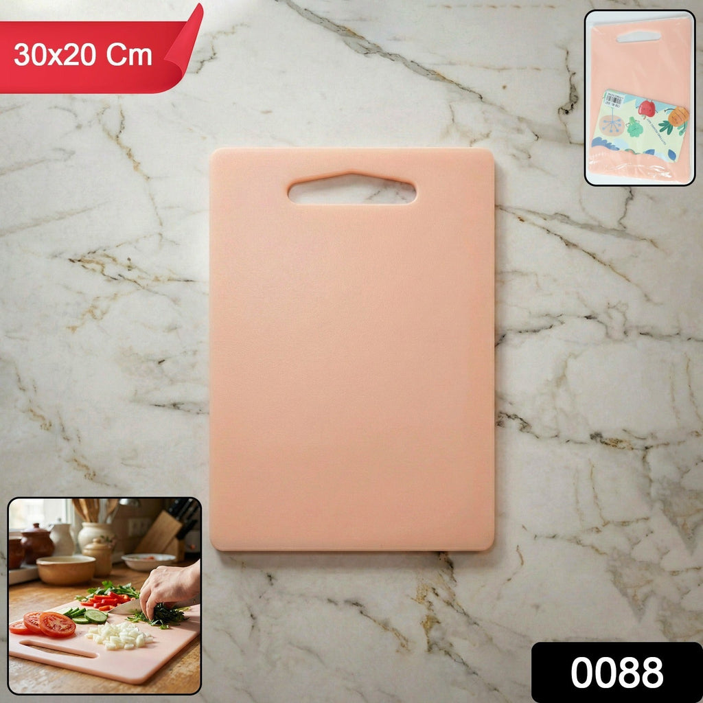 Kitchen chopping board in use with handle grip