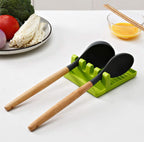 Multi-functional silicone spatula holder keeping kitchen utensils organized.