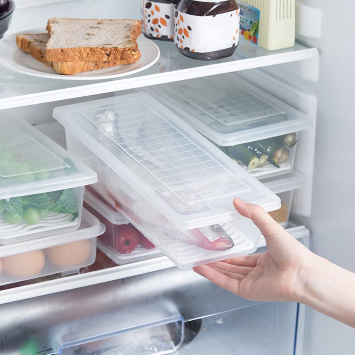 Multiple plastic food storage containers stacked neatly, saving fridge space.